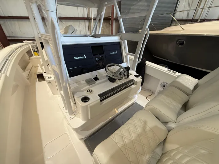  Yacht Photos Pics 2022 Invincible 39 Open Fisherman boat cockpit with Garmin navigation system.