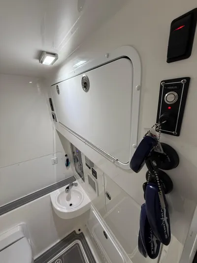  Yacht Photos Pics 2022 Invincible 39 Open Fisherman interior with sink and storage compartments.