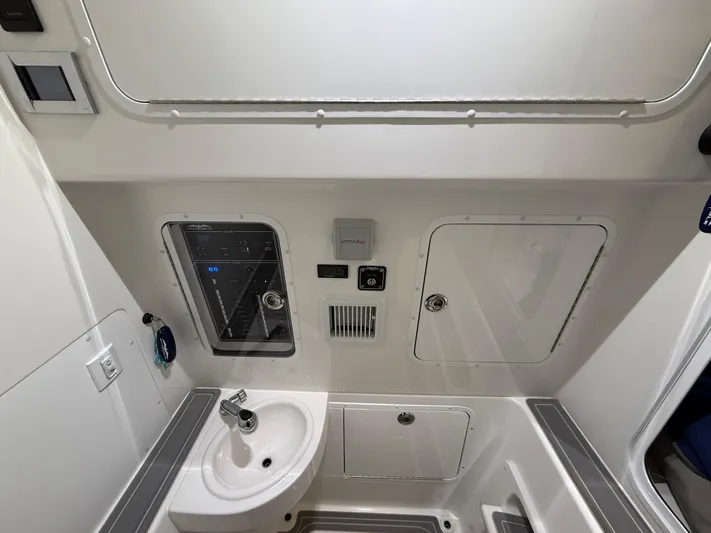  Yacht Photos Pics 2022 Invincible 39 Open Fisherman interior with sink and control panel.