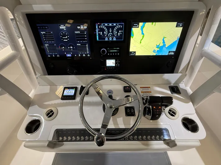  Yacht Photos Pics Invincible 39 Open Fisherman 2022 dashboard with navigation screens and controls.