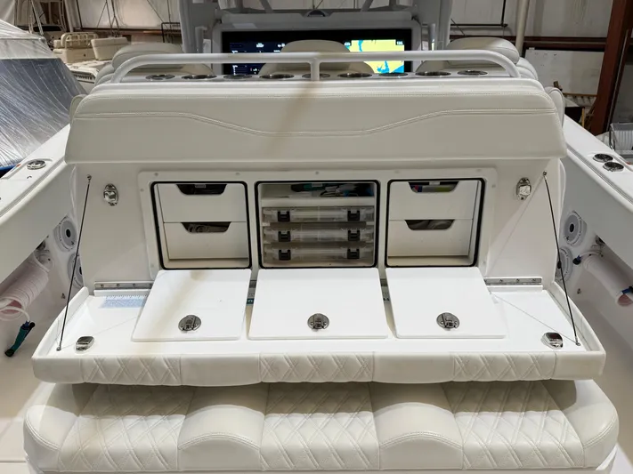  Yacht Photos Pics 2022 Invincible 39 Open Fisherman boat with white storage compartments and seating.
