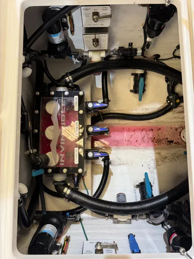  Yacht Photos Pics 2022 Invincible 39 Open Fisherman boat engine compartment with hoses and components.