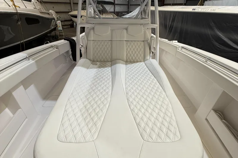  Yacht Photos Pics Invincible 39 Open Fisherman 2022 boat interior with white quilted seating.