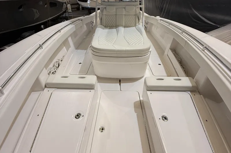  Yacht Photos Pics 2022 Invincible 39 Open Fisherman boat interior with white seating and spacious deck.