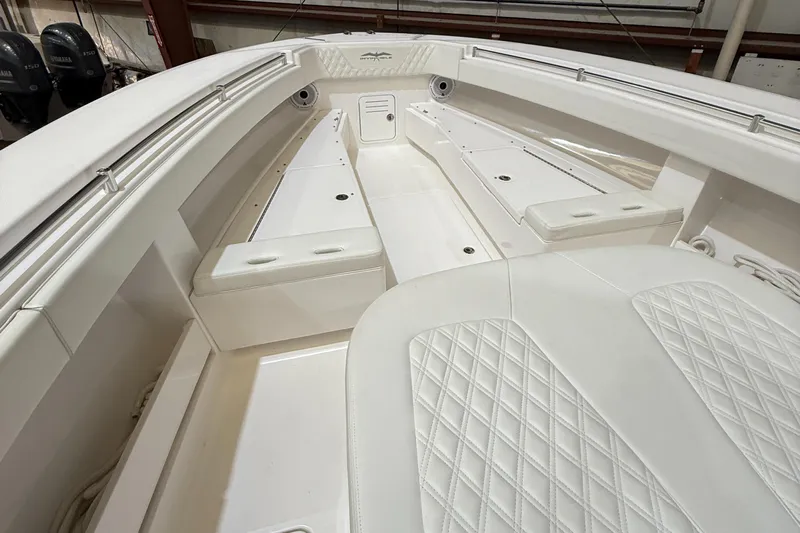  Yacht Photos Pics 2022 Invincible 39 Open Fisherman boat interior with white cushioned seating.