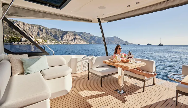  Yacht Photos Pics Luxury yacht Prestige M48, 2025 model, with scenic ocean view and elegant outdoor seating.