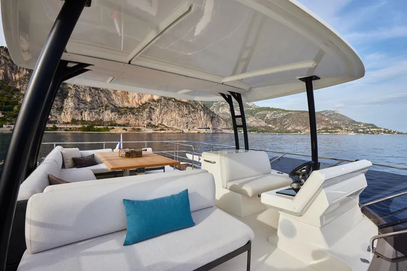  Yacht Photos Pics Luxurious 2025 Prestige M48 yacht interior with scenic coastal view.