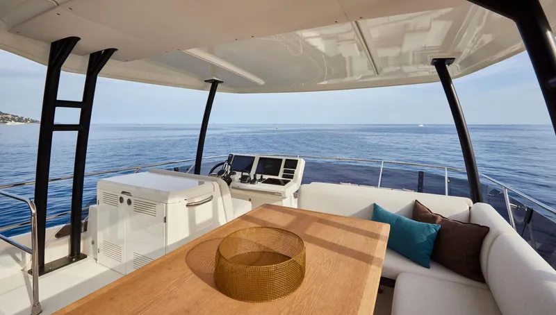  Yacht Photos Pics Luxurious 2025 Prestige M48 yacht interior with ocean view, featuring a stylish seating area.