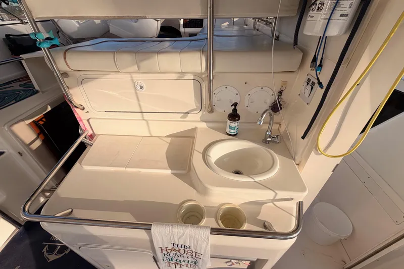 Island Time Yacht Photos Pics 1998 Sea Ray 420 Aft Cabin yacht interior with sink and countertop area.