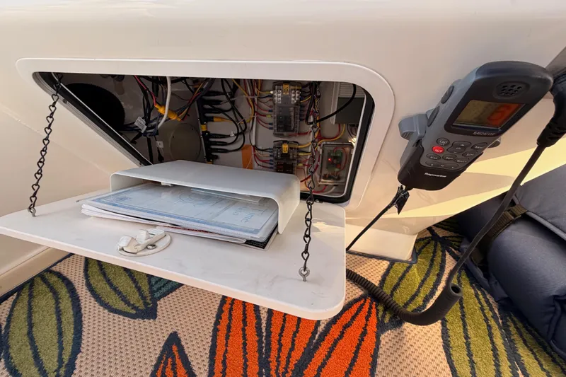 Island Time Yacht Photos Pics 1998 Sea Ray 420 Aft Cabin electrical panel with radio and documents.