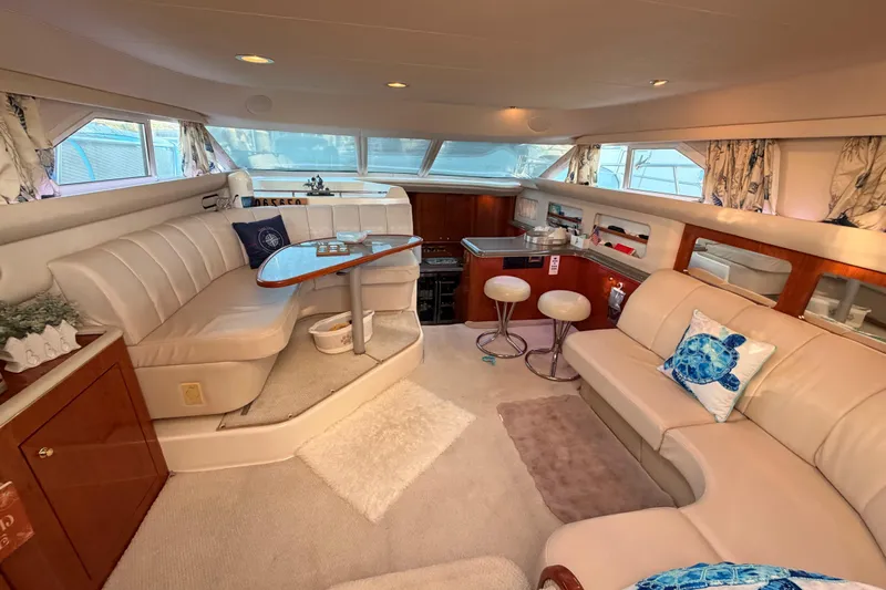 Island Time Yacht Photos Pics Luxurious interior of 1998 Sea Ray 420 Aft Cabin yacht with elegant seating and decor.