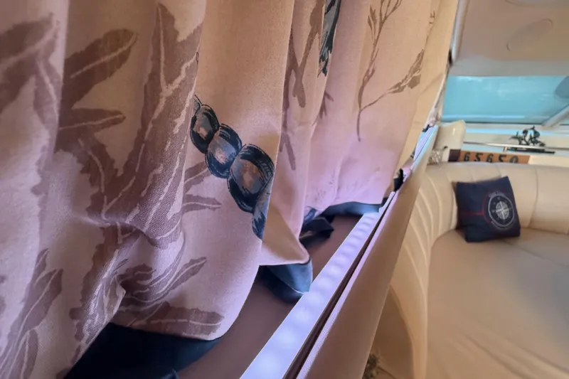 Island Time Yacht Photos Pics Interior of 1998 Sea Ray 420 Aft Cabin with decorative curtains and plush seating.