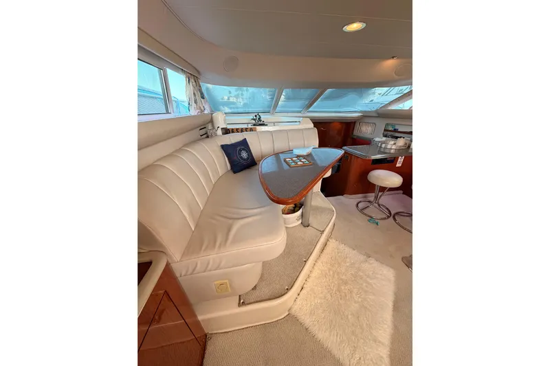Island Time Yacht Photos Pics Luxurious interior of 1998 Sea Ray 420 Aft Cabin yacht with plush seating and elegant decor.