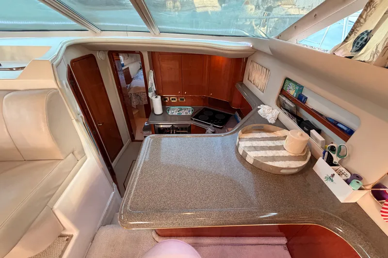 Island Time Yacht Photos Pics Interior of 1998 Sea Ray 420 Aft Cabin yacht with kitchen and seating area.