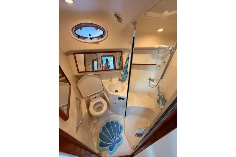 Island Time Yacht Photos Pics Bathroom interior of 1998 Sea Ray 420 Aft Cabin yacht with shower and toilet.