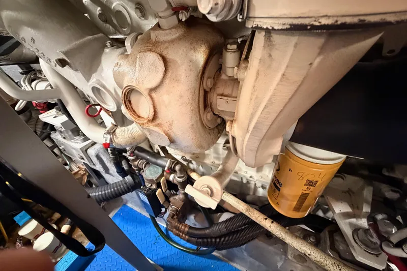 Island Time Yacht Photos Pics Engine components of a 1998 Sea Ray 420 Aft Cabin boat, featuring hoses and filters.