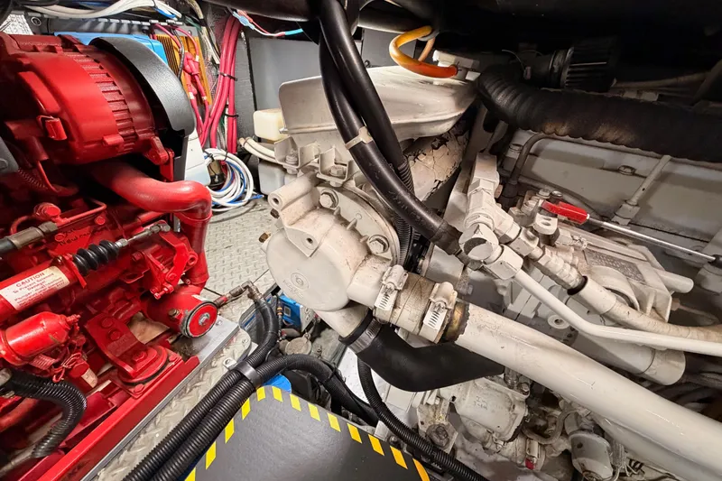 Island Time Yacht Photos Pics Engine room of a 1998 Sea Ray 420 Aft Cabin with visible machinery and components.