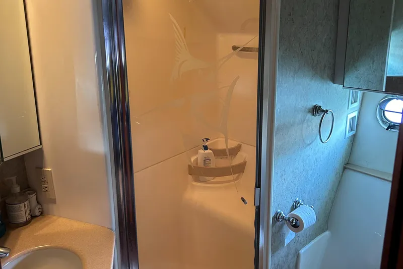 Dividend Yacht Photos Pics Bathroom interior of 2000 Tiara Yachts 5000 Express with shower and sink.