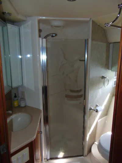 Dividend Yacht Photos Pics Bathroom interior of 2000 Tiara Yachts 5000 Express with shower and sink.