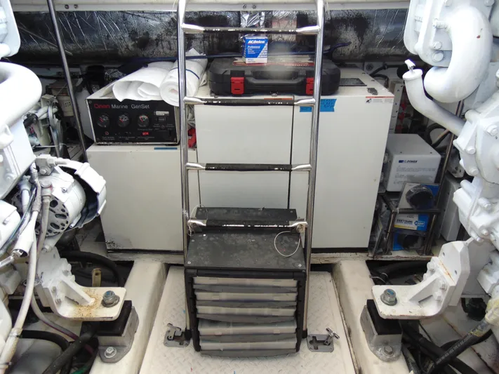 Dividend Yacht Photos Pics Engine room of 2000 Tiara Yachts 5000 Express with equipment and ladder.