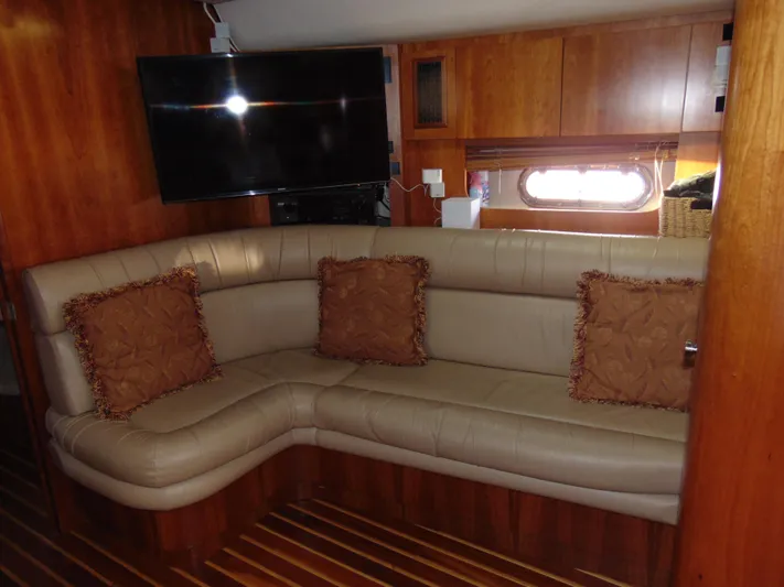 Dividend Yacht Photos Pics Luxurious interior of 2000 Tiara Yachts 5000 Express with leather seating and TV.