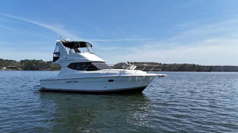 Stress Relief Yacht Photos Pics 2007 Silverton 36 Convertible yacht on calm water under clear blue sky.