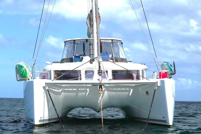 Momentum Yacht Photos Pics Front view of a 2012 Lagoon 450 F catamaran on the water.