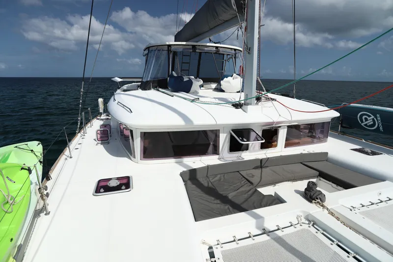 Momentum Yacht Photos Pics 2012 Lagoon 450 F catamaran on open sea under clear skies.