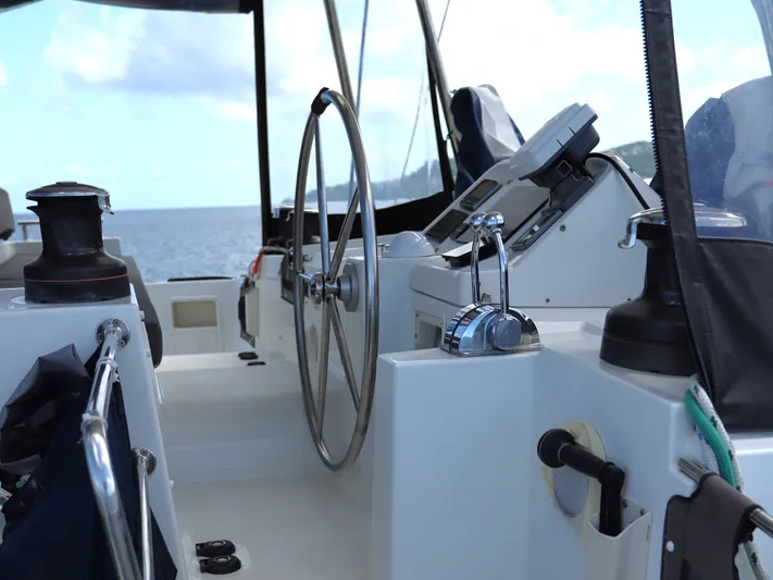 Momentum Yacht Photos Pics Helm of 2012 Lagoon 450 F catamaran with ocean view in background.