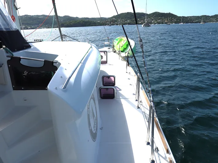 Momentum Yacht Photos Pics Sailing on a 2012 Lagoon 450 F catamaran with scenic coastal views.
