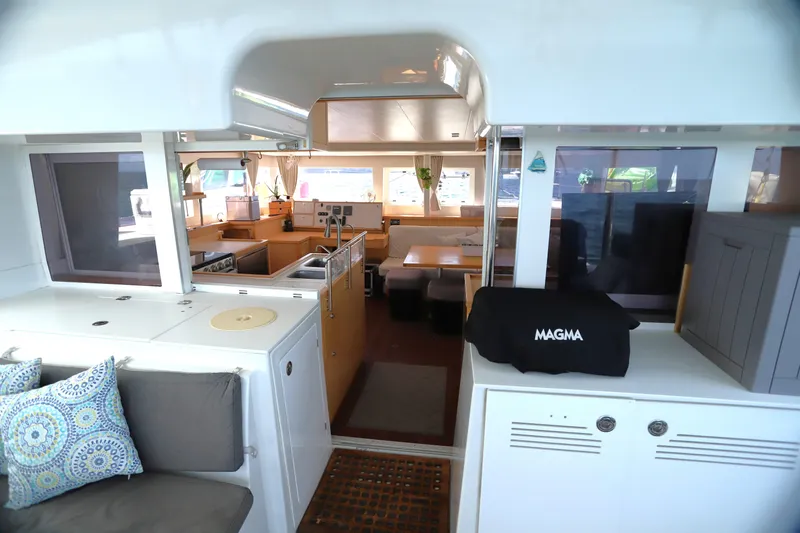Momentum Yacht Photos Pics Interior of 2012 Lagoon 450 F catamaran, featuring spacious seating and modern kitchen area.