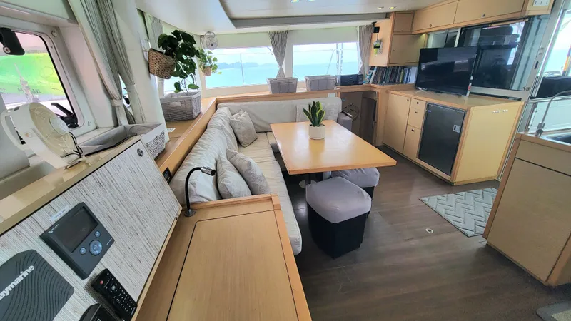 Momentum Yacht Photos Pics Interior of 2012 Lagoon 450 F catamaran with modern furnishings and panoramic windows.
