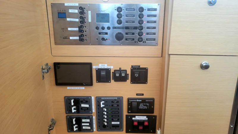 Momentum Yacht Photos Pics Control panel of a 2012 Lagoon 450 F yacht with various switches and displays.