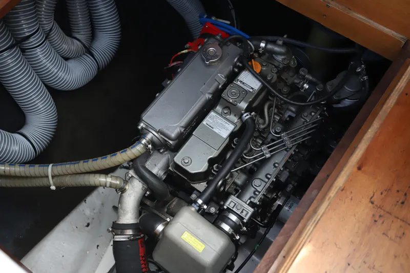 Momentum Yacht Photos Pics Engine compartment of a 2012 Lagoon 450 F catamaran, showcasing mechanical components.