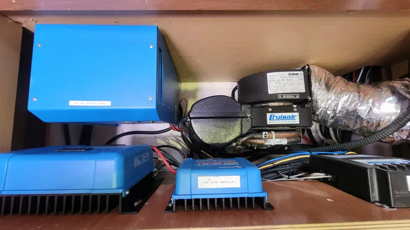 Momentum Yacht Photos Pics Electrical components inside a 2012 Lagoon 450 F yacht, featuring blue power units and wiring.