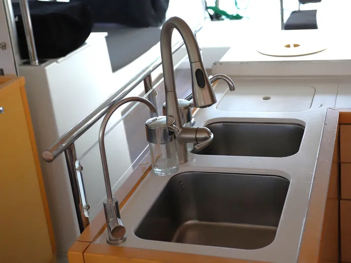 Momentum Yacht Photos Pics Modern kitchen sink with dual basins in a 2012 Lagoon 450 F yacht.