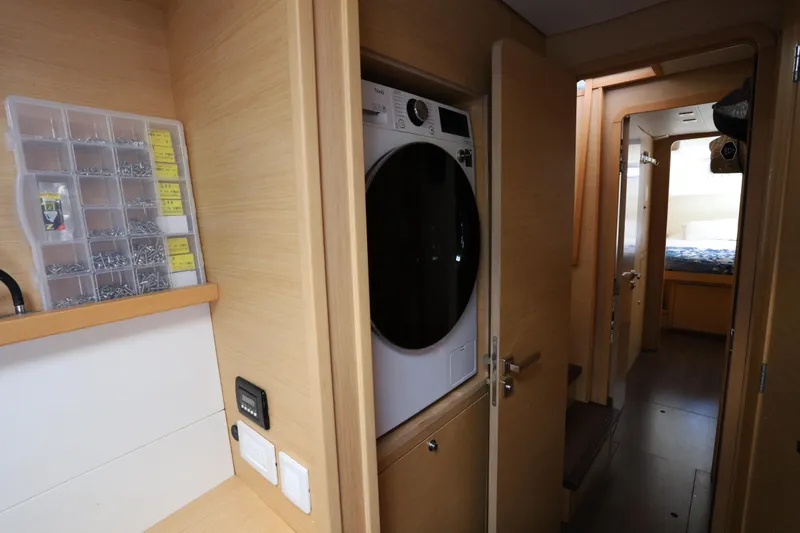 Momentum Yacht Photos Pics Interior of 2012 Lagoon 450 F yacht with washer and cozy cabin hallway.