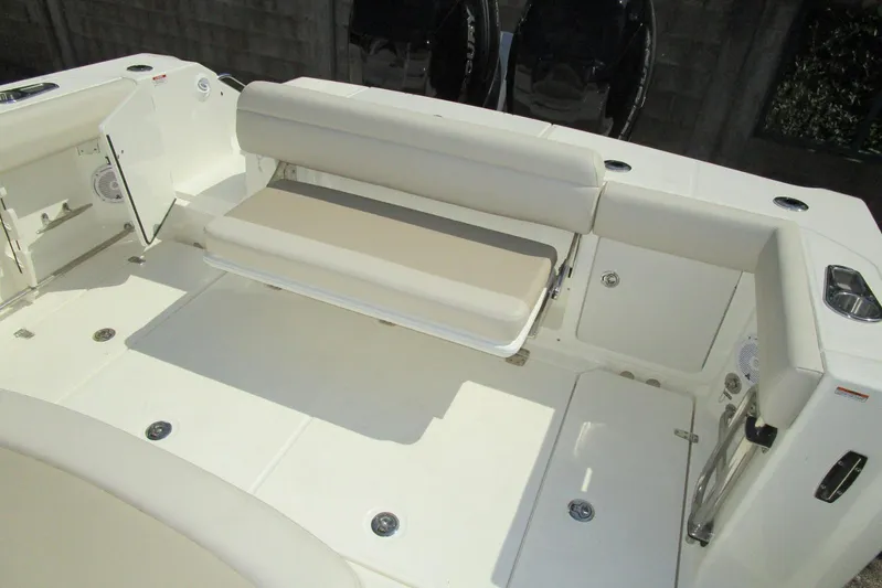 2020 Boston Whaler 330 Or @ Vallarta Yacht Photos Pics 2020 Boston Whaler 330 Outrage boat interior with foldable seating and storage compartments.