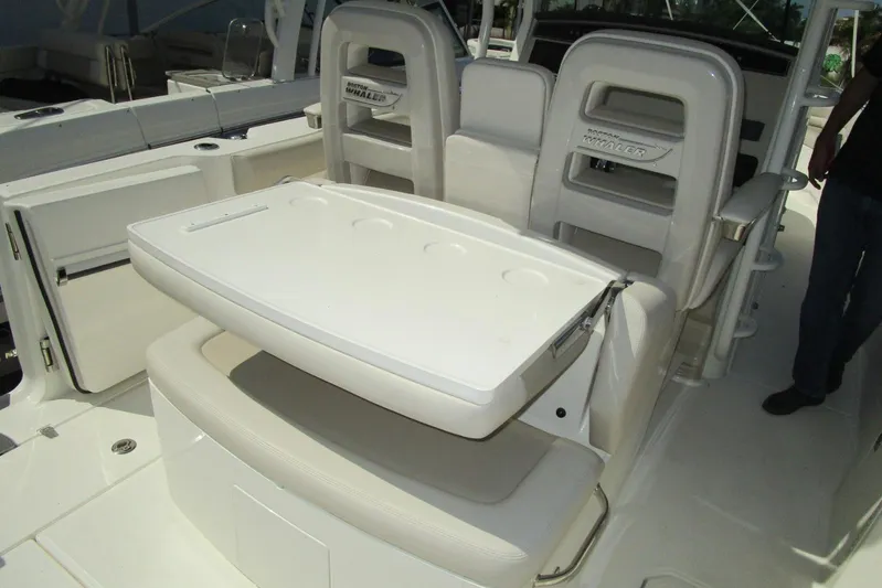 2020 Boston Whaler 330 Or @ Vallarta Yacht Photos Pics 2020 Boston Whaler 330 Outrage boat interior with foldable seating and storage.