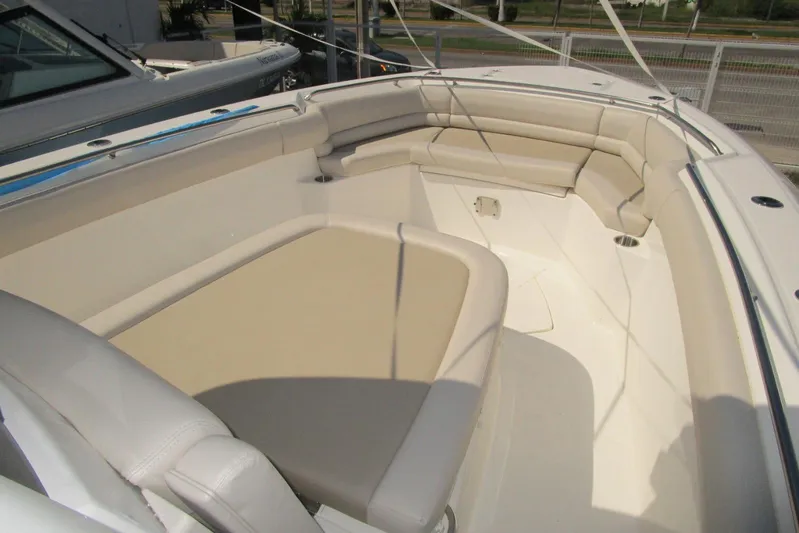 2020 Boston Whaler 330 Or @ Vallarta Yacht Photos Pics 2020 Boston Whaler 330 Outrage boat interior with beige seating and spacious layout.