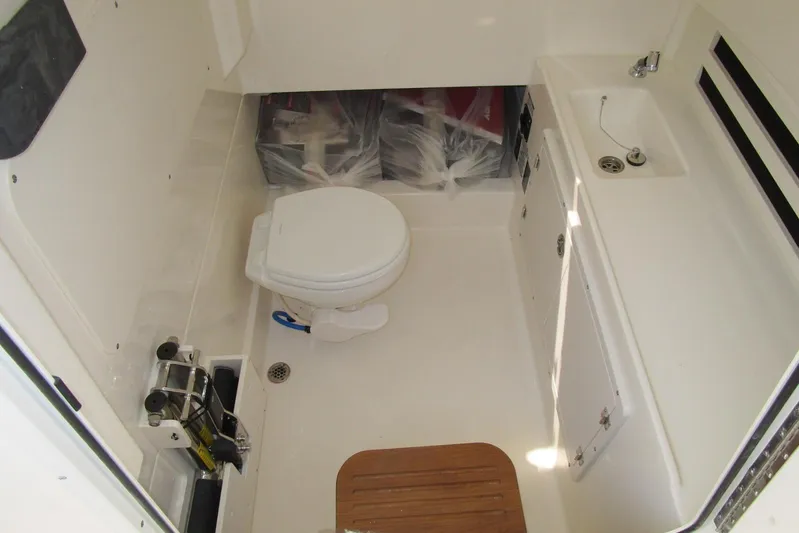 2020 Boston Whaler 330 Or @ Vallarta Yacht Photos Pics 2020 Boston Whaler 330 Outrage boat bathroom with toilet and sink.