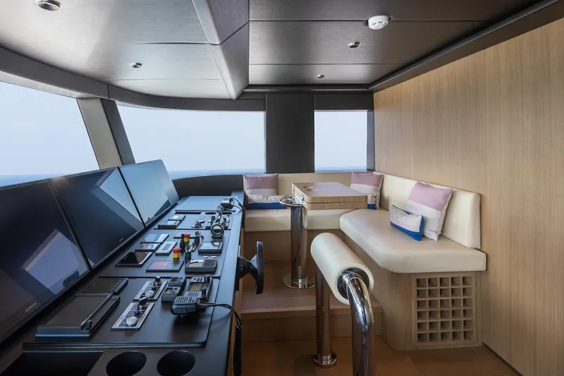 Order To Build Yacht Photos Pics Luxurious interior of 2026 Majesty 111 yacht with modern control panel and seating area.
