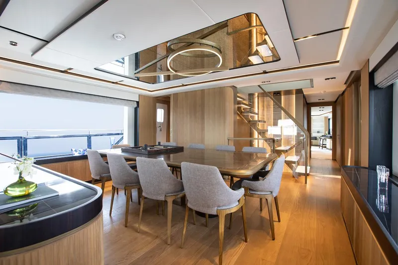 Order To Build Yacht Photos Pics Luxurious interior of 2026 Majesty 111 yacht with elegant dining area and modern design.