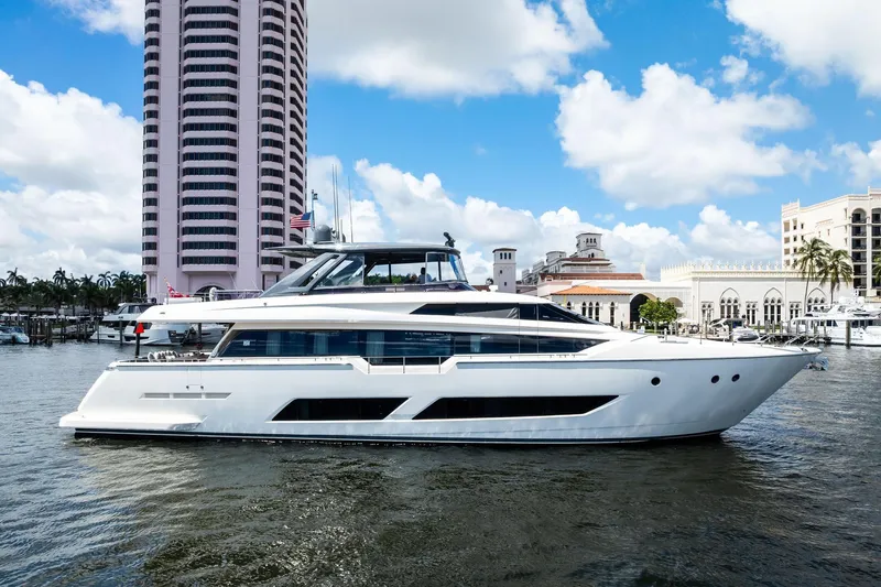 Alter Ego Yacht Photos Pics 2018 Ferretti Yachts 850 Motoryacht docked near waterfront buildings under blue sky.