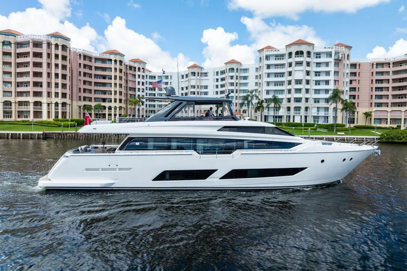 Alter Ego Yacht Photos Pics 2018 Ferretti Yachts 850 Motoryacht cruising near waterfront buildings.
