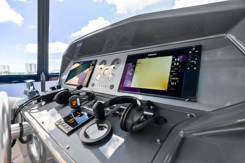 Alter Ego Yacht Photos Pics Control panel of 2018 Ferretti Yachts 850 Motoryacht with navigation screens and equipment.