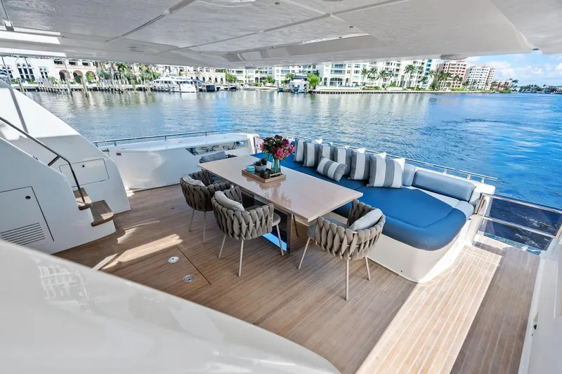 Alter Ego Yacht Photos Pics Luxurious deck of 2018 Ferretti Yachts 850 Motoryacht with elegant seating and waterfront view.