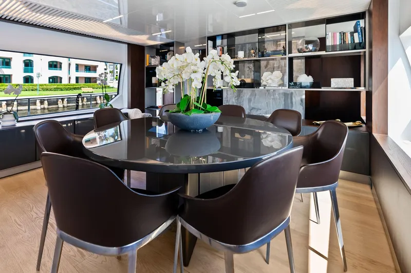 Alter Ego Yacht Photos Pics Luxurious dining area on 2018 Ferretti Yachts 850 Motoryacht with elegant decor and large windows.