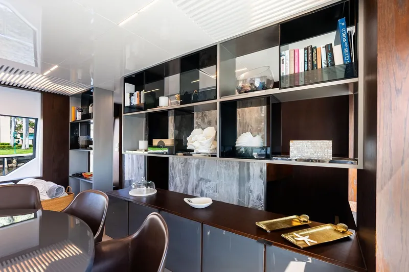 Alter Ego Yacht Photos Pics Luxurious interior of 2018 Ferretti Yachts 850 Motoryacht with elegant shelving and decor.