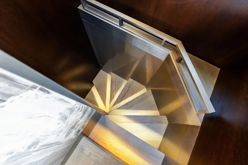 Alter Ego Yacht Photos Pics Spiral staircase inside 2018 Ferretti Yachts 850 Motoryacht, featuring sleek modern design.